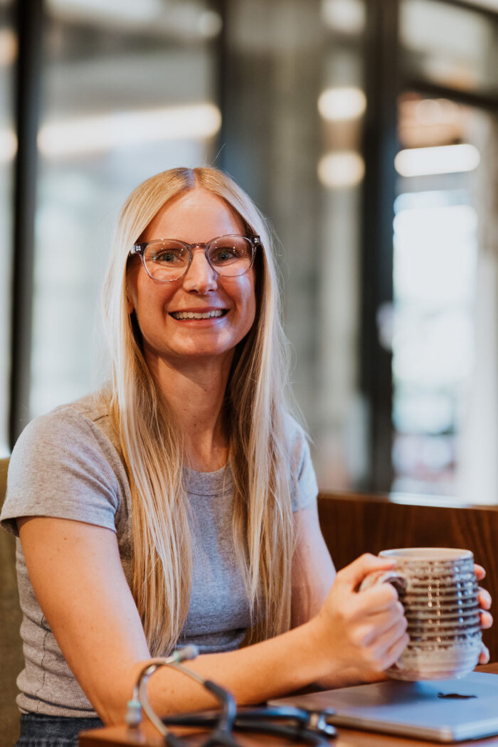 Alison Percowycz, NP sitting and drinking coffee