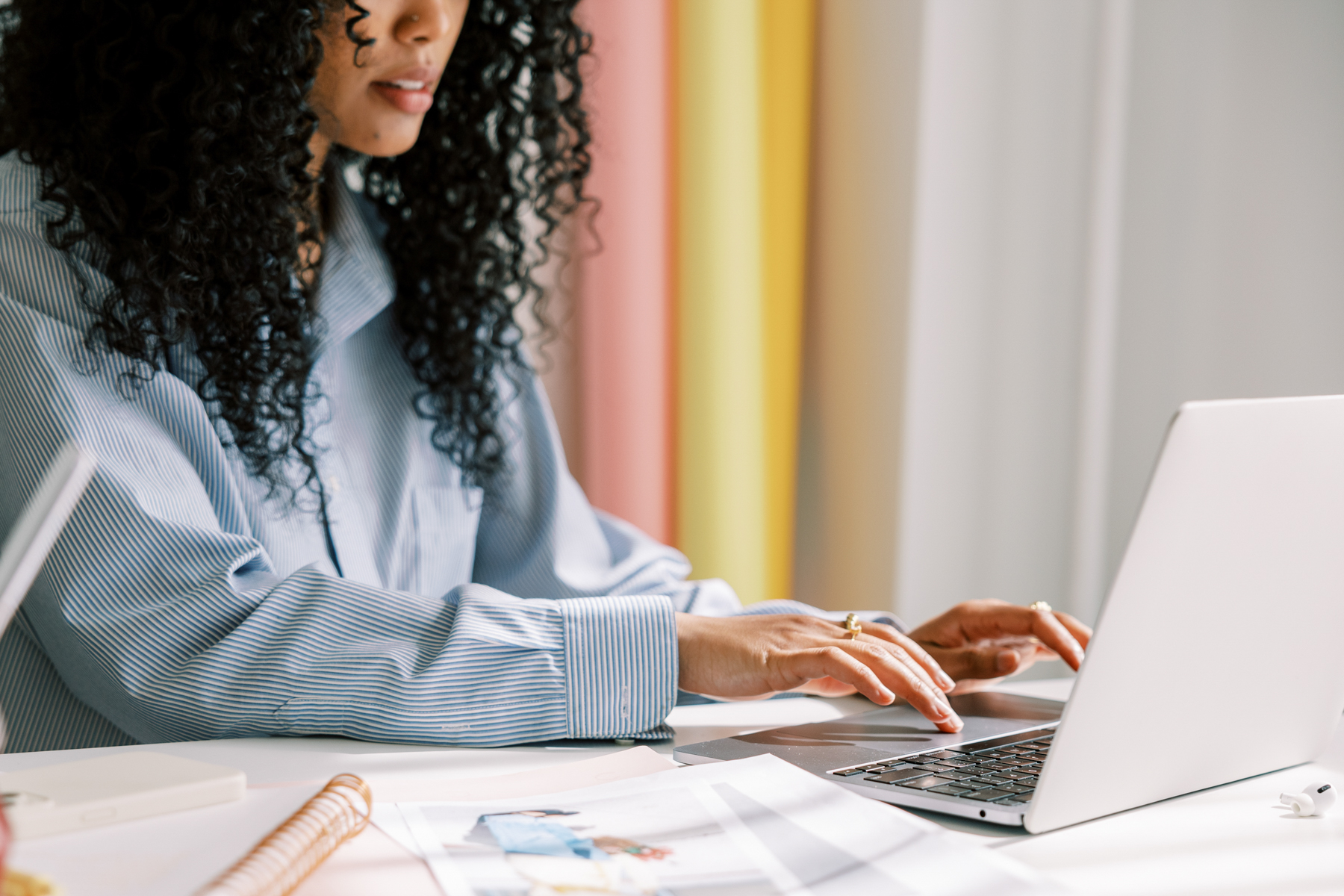 Woman working at laptop researching